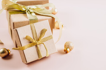 Fashion gifts or presents boxes with golden bows and balls Composition for Christmas.