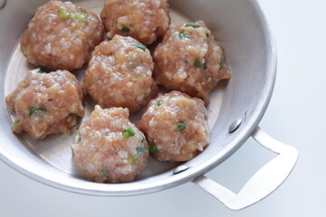 Homemade scallion and green onion meat ball on pan for Chinese cooking