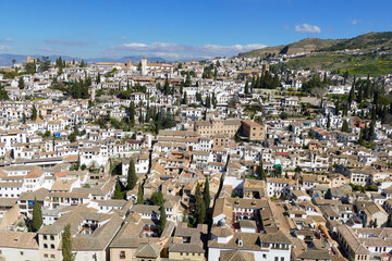 Fototapeta na wymiar View of the City and Hillside of Beautiful Colonial Granada, Andalusia / Spain on a Clear Sunny Day