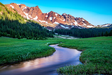 Stream through meadow surrounded by mountains, Snowmass Wilderness