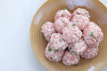 homemade Chinese pork meat ball on brown dish