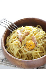 Italian food, carbonara spaghetti in wooden bowl