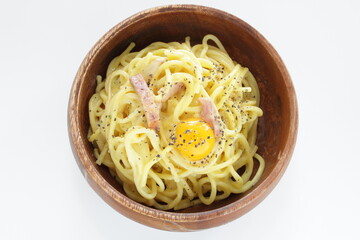 Italian food, carbonara spaghetti in wooden bowl