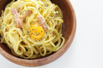 Italian food, carbonara spaghetti in wooden bowl