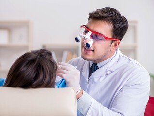 Patient visiting dentist for regular check-up and filling