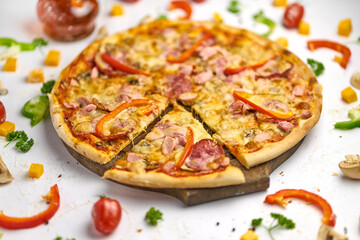 Delicious pizza with sausage, mushrooms, bell pepper on wooden plate