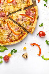 Delicious pizza with sausage, mushrooms, bell pepper on wooden plate