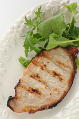 Homemade grilled rice yeast pork served with baby leaves