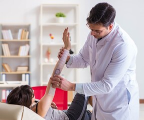 Doctor checking patients joint flexibility