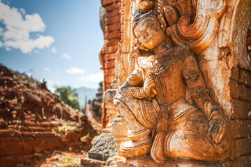 Fototapeta na wymiar A stone statue seen at an ancient temple ruins in Myanmar. 
