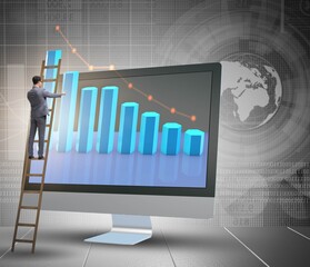 Businessman in economic forecasting concept with charts