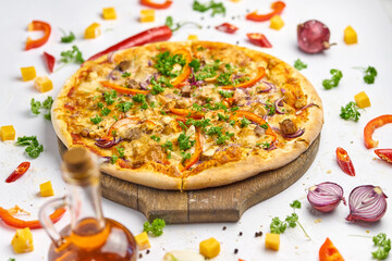Pizza with chicken, mushrooms and sweet pepper on wooden plate