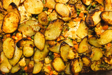 plant-based food, vegan potato bake with garden vegetables and nutritional yeast sauce