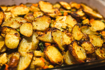 plant-based food, vegan potato bake with garden vegetables and nutritional yeast sauce