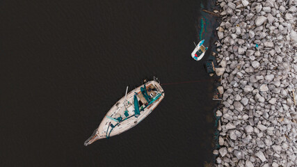 shipwreck of sailing yatch in the sea during an accident after hurricane sally in florida