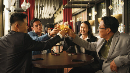 businesspeople toasting and clinking wine or champagne together