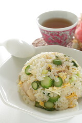 green asparagus and chicken fried rice on white dish
