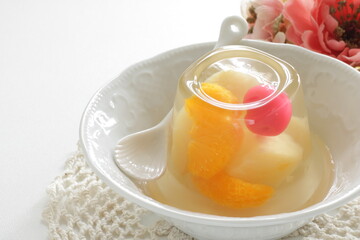 Mixed fruit Jelly in bowl on white background with copy space