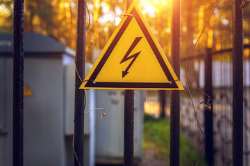 High voltage sign at sunset. top view.