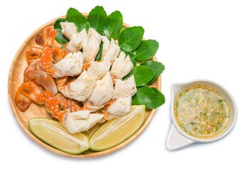 steamed crab with spicy seafood sauce on the wooden plate.steamed blue crab with spicy dip, thai style, seafood.