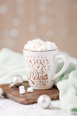 Mug with coffee and marshmallow, sweater, cinnamon. Cozy christmas composition. Hygge concept Soft focus - Image