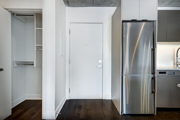 Real estate photography - Beautiful empty brand new apartment in an apartment building with bathroom, new kitchen, new floors, all white painted