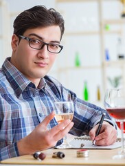 The professional sommelier tasting red wine