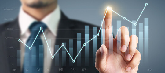 Businessman plan graph growth and increase of chart positive indicators in his business