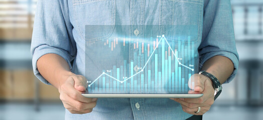 Business plan graph growth increase of chart positive indicators in his business, tablet in hand