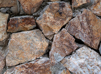 texture of stones on the ground gray and orange. stone background