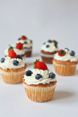 cupcakes with strawberry and blueberries