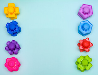 Creative flat lay view from above. Children's educational toy, bolts made of plastic. 