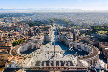 Aerial view of the square in front of St. Peter's Basilica and the city of Rome, stretching to the horizon