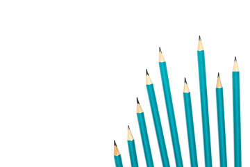 Green graphite pencils on a white background.