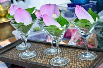 Chaplet leaves and lotus petals in a wine glass