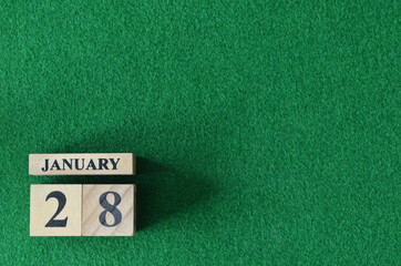 January 28, number cube on  snooker table, sport background.