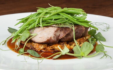 beef fillet over baked pate with french beans on top