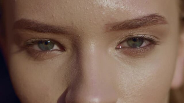 Close up young face woman with green eyes at sunset beautiful model cute eyebrow attractive eyelash portrait slow motion