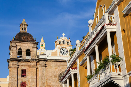 View to ensemble of impressive church San Pedro Claver and traditional colorful houses with blue sky, Cartagena, Colombia, Unesco World Heritage