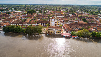 Aerial view of the historic town Santa Cruz de Mompox in sunlight with river and Iglesia De Santa...