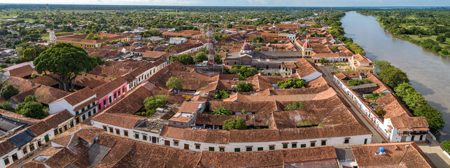 Panoramic aerial view of the historic town Santa Cruz de Mompox and river in sunlight, Colombia, World Heritage