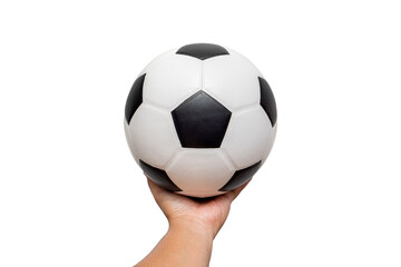Classic leather soccer ball in hand of young man isolated on white background. Traditional black and white football equipment to play a competitive game. This photo can be used for sport concept.
