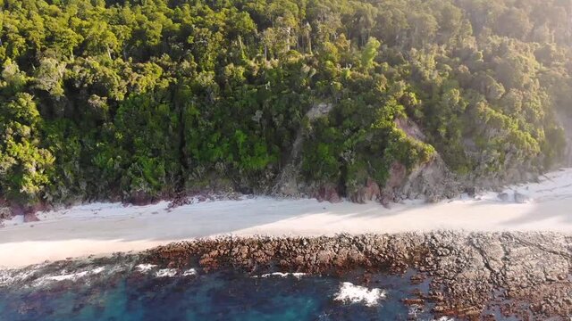 Stunning Coastal Landscape Of The West Coast At Monro Beach In New Zealand On A Sunny Afternoon - descending drone shot