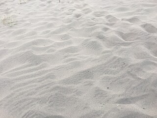 closeup of sand pattern of a beach in the summer