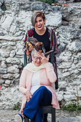 portrait of latin woman granddaughter and grandmother, with his dog in Mexico Latin America