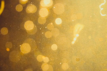 Dark Abstract Gold bokeh sparkle on black