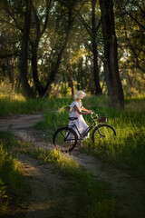 Fototapeta premium girl in green summer forest