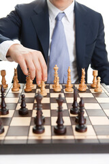 businessman moving chess piece