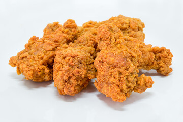 Hot fried chicken leg spicy on white background. Delicious southern Kentucky drumstick crunchy meal. Recipe fast food pieces. Junk food.