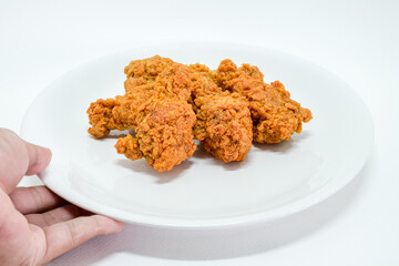 Hot fried chicken leg spicy on white background. Delicious southern Kentucky drumstick crunchy meal. Recipe fast food pieces. Junk food.